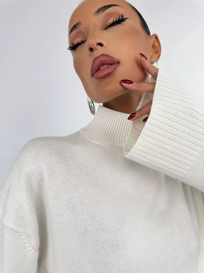 Bianca Sweater by Lauven in white, oversized knitwear with high neck, showcasing elegance and comfort.