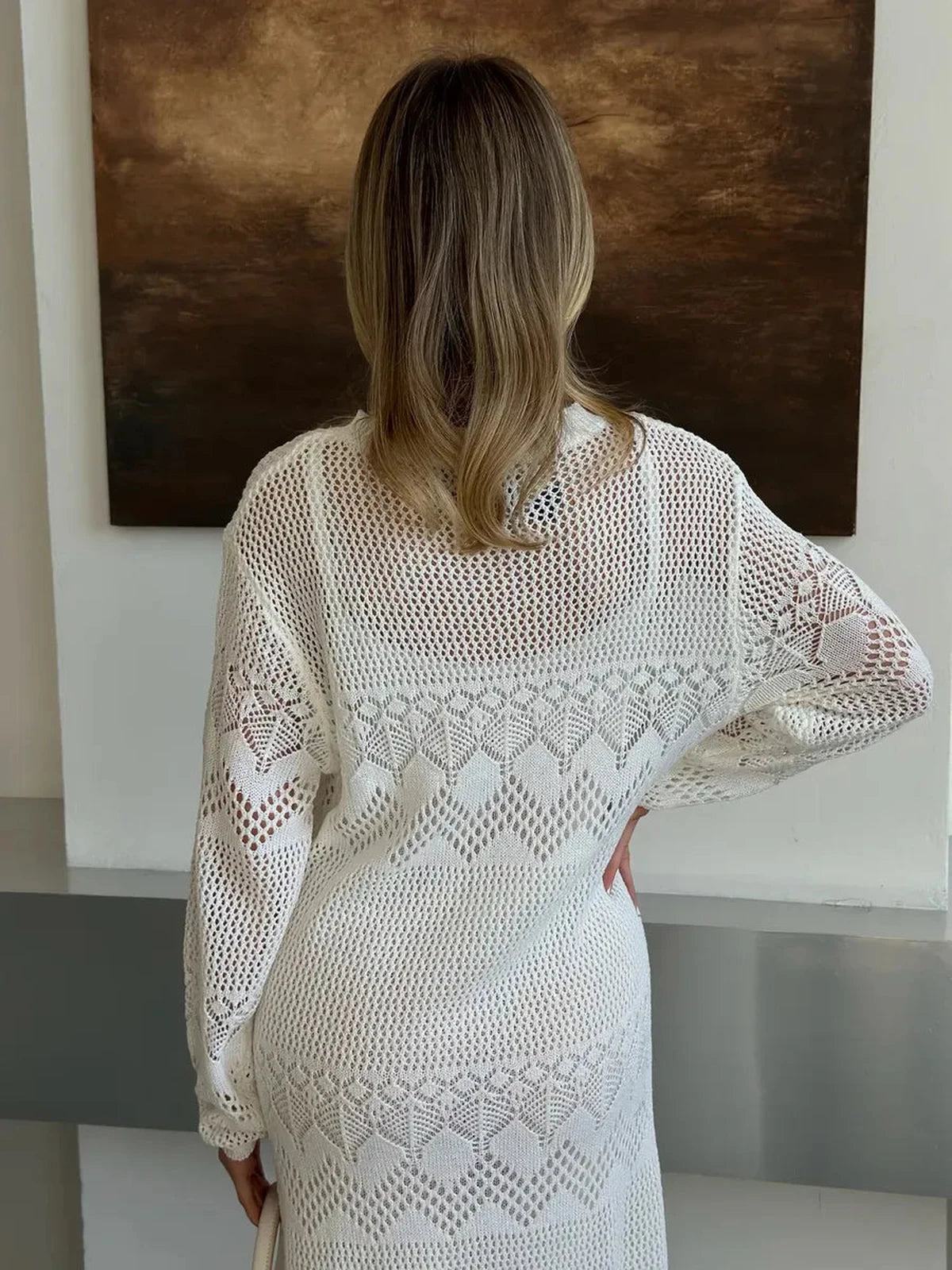 Aurelia Maxi Dress by Lauven showcasing its airy crochet elegance from the back, perfect for summer styling.