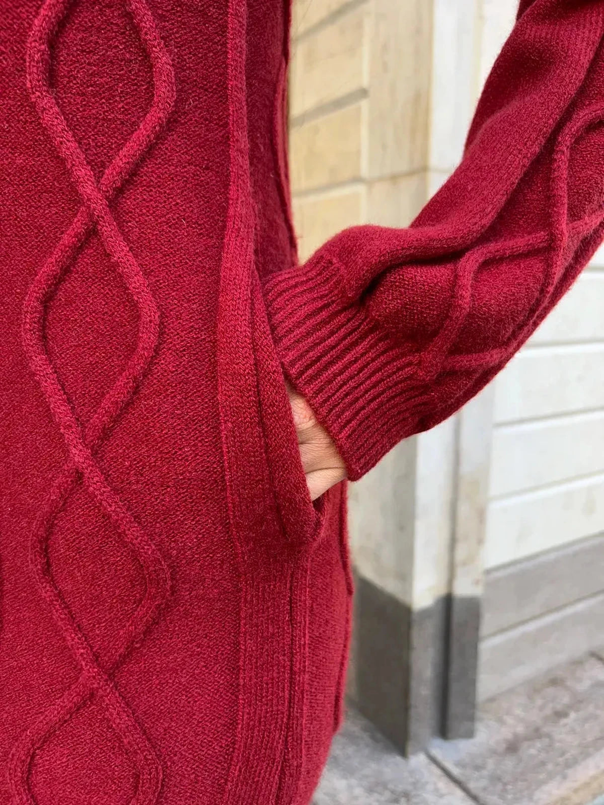 Close-up of Crimson Midi Dress by Lauven showcasing textured knit pattern and pocket detail.