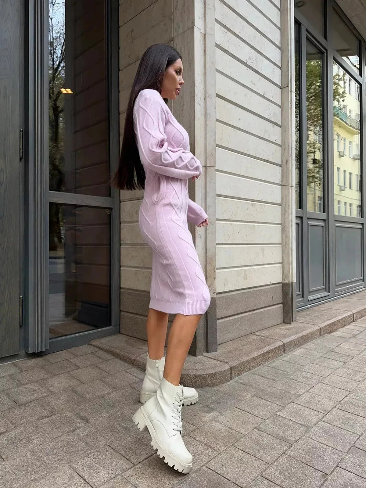 Luna Midi Dress by Lauven in soft pink worn with trendy white boots, showcasing elegant design and texture.