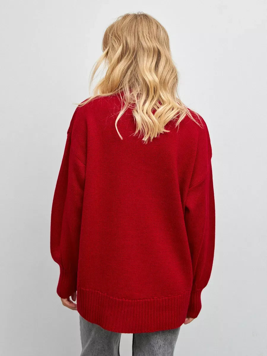 Back view of a woman wearing the Sienna Sweater by Lauven, a cozy oversized knit turtleneck in deep red.