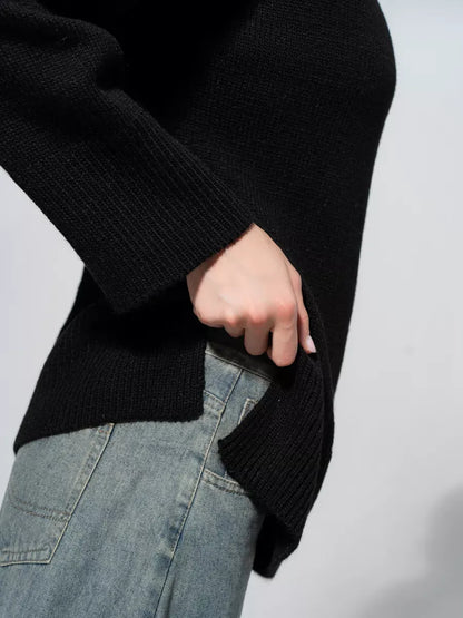 Onyx Sweater by Lauven, oversized black knitwear featuring a side slit detail, ideal for casual layering.