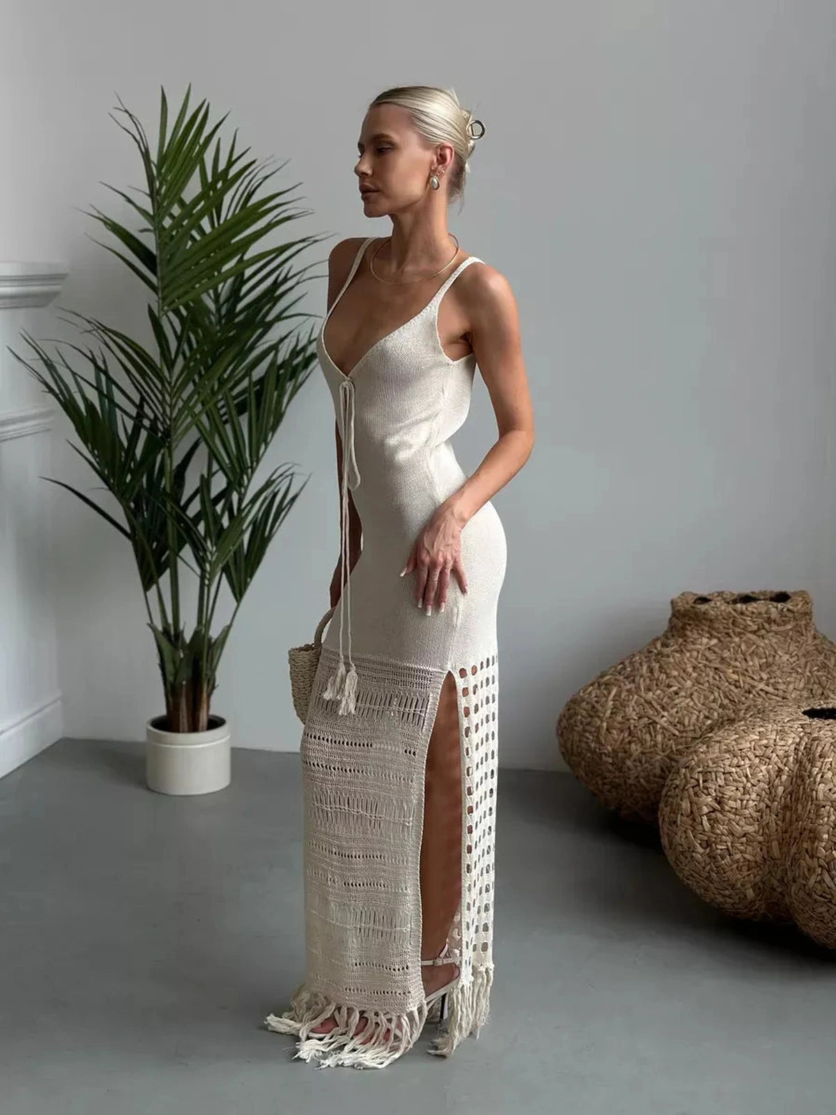 Lunara Maxi Dress by Lauven featuring soft knit texture, openwork elegance, and fringe hem movement.