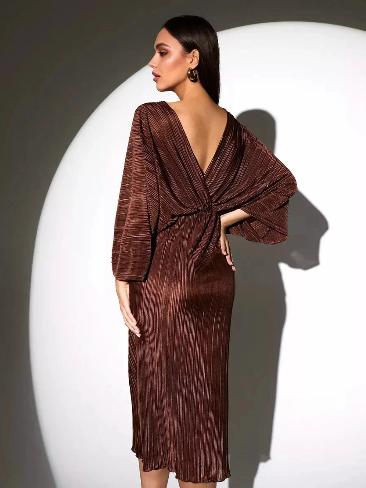 Vega Midi Dress by Lauven, showcasing a chocolate pleated fabric and elegant V-neckline with flowing sleeves.
