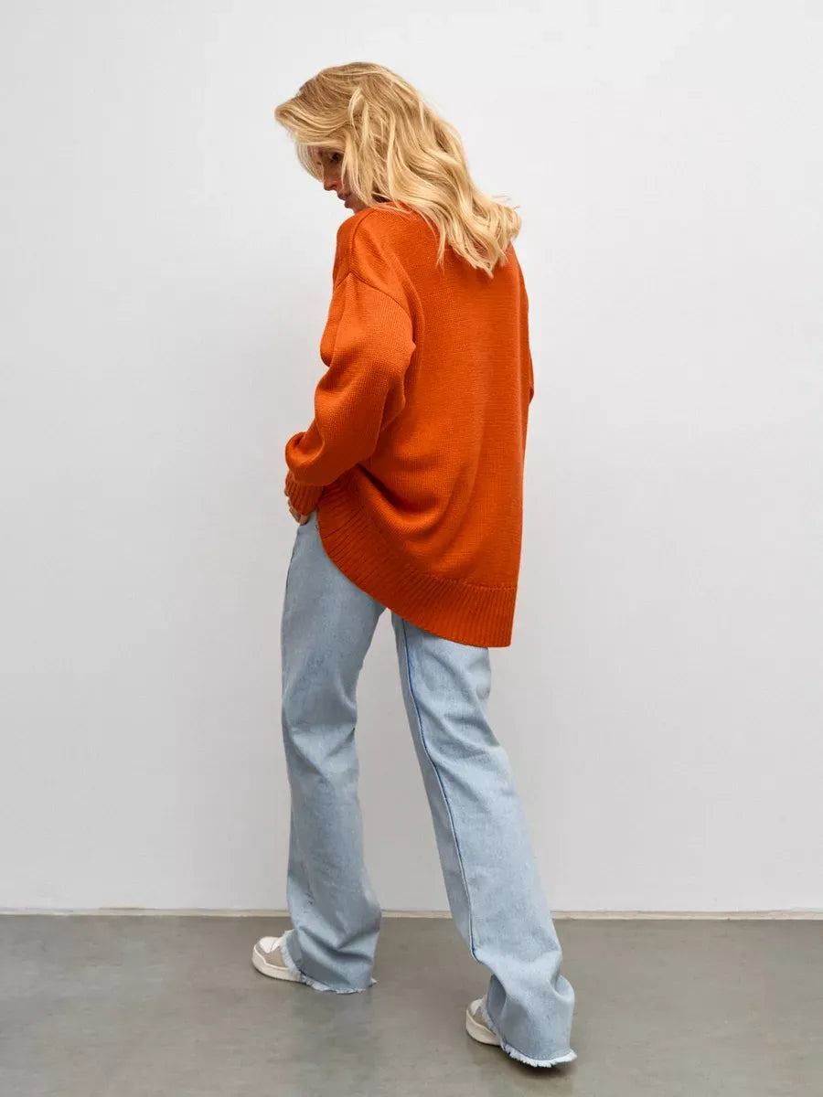 Ember Sweater by Lauven, oversized women's wool knit turtleneck in terracotta, styled with relaxed blue jeans.