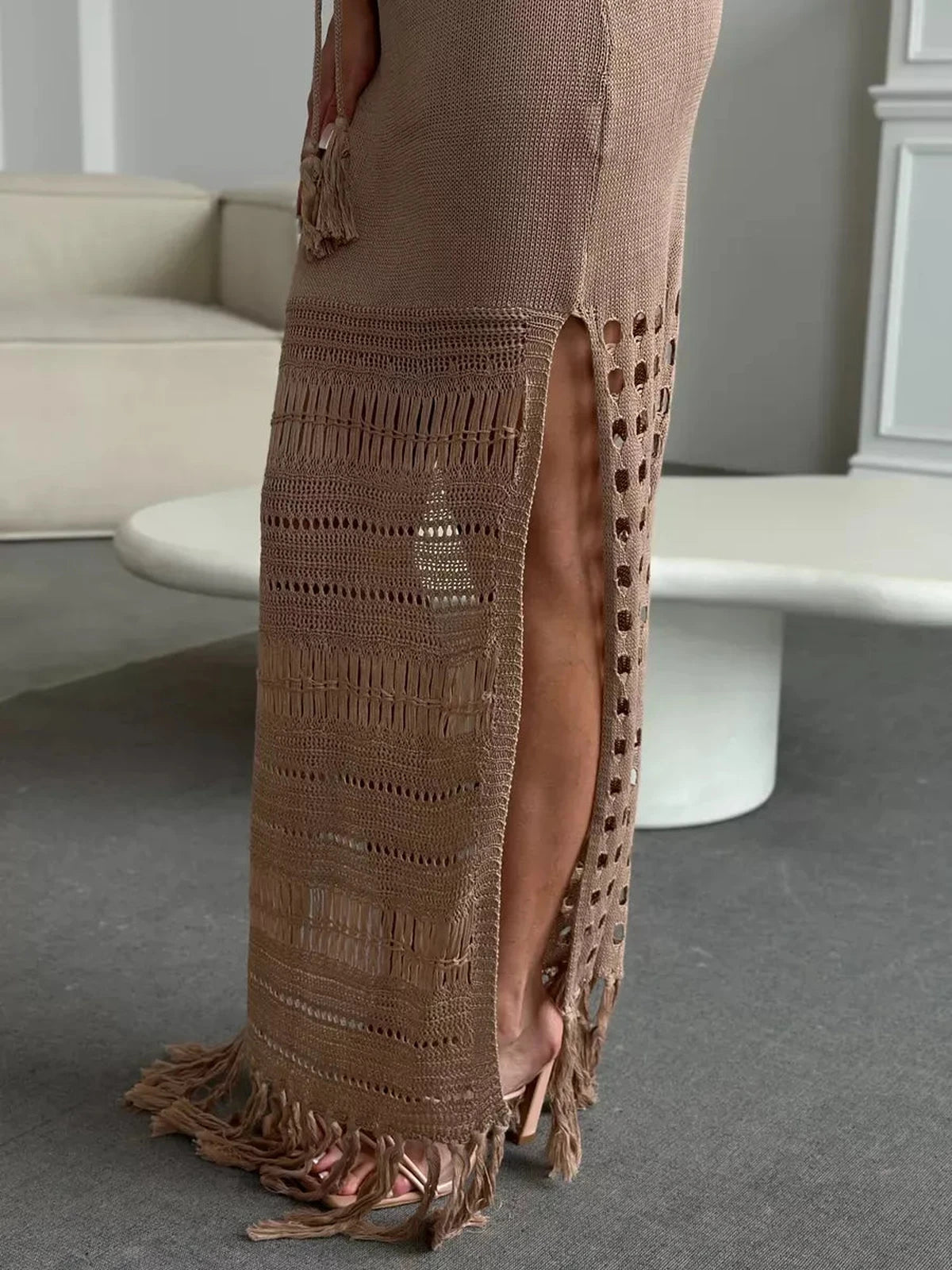 Calysta Maxi Dress by Lauven showcasing a soft knit texture, side-slit elegance, and fringe hem movement.
