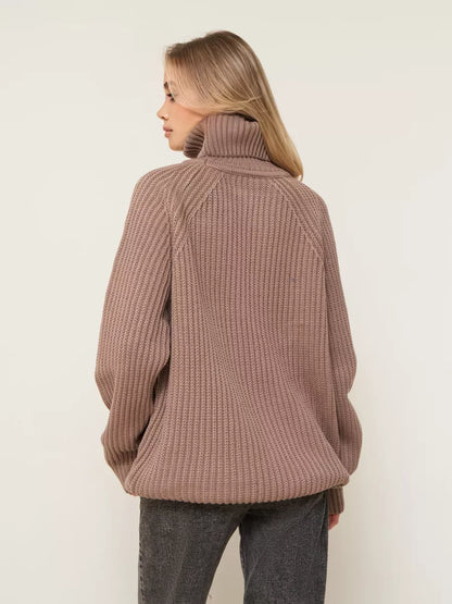 Model wearing the Sable Sweater by Lauven, an oversized brown knitwear with a cozy turtleneck detail.