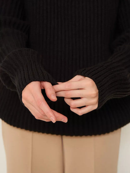 Onyx Sweater by Lauven, oversized black knitwear with cozy turtleneck and ribbed sleeves.
