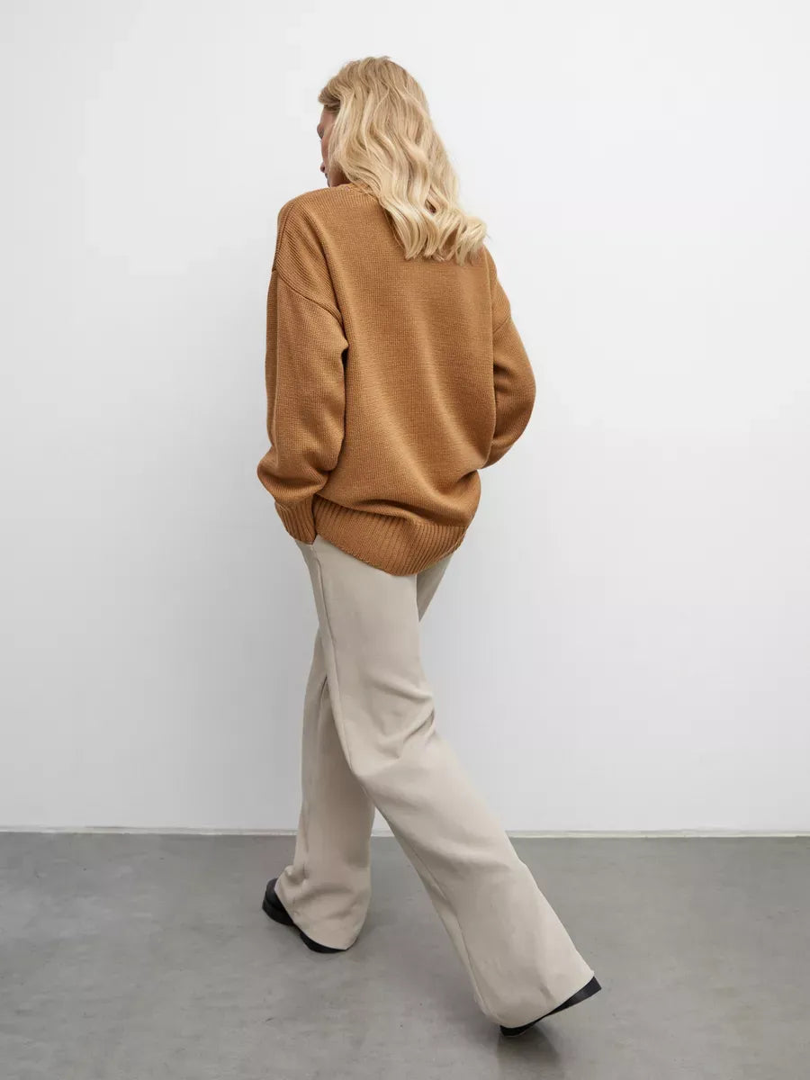 Marlo Sweater by Lauven — Oversized women's knit in camel with asymmetric hem, showcasing cozy elegance.