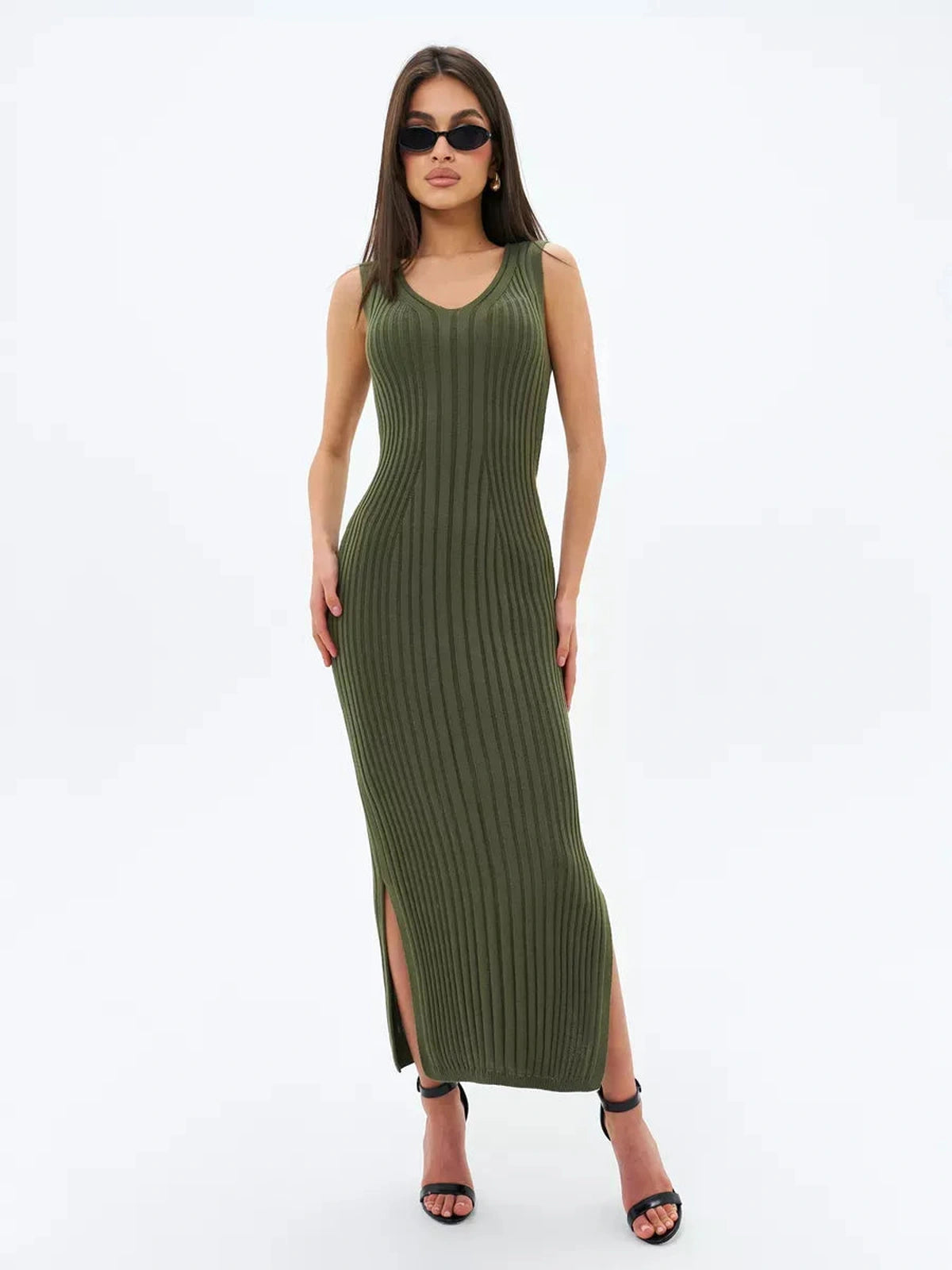 Model wearing the Olivea Midi Dress in khaki green, showcasing its ribbed texture and elegant side slit.
