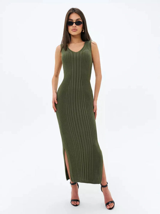 Model wearing the Olivea Midi Dress in khaki green, showcasing its ribbed texture and elegant side slit.