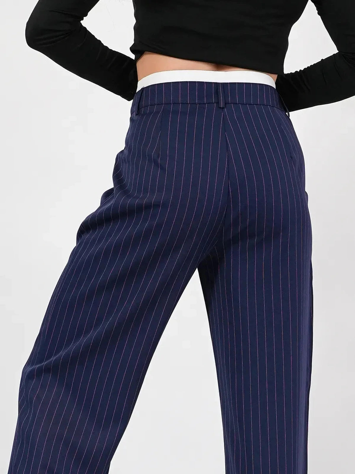 Aster Pants by Lauven featuring a high-waist, wide-leg silhouette in navy with elegant pinstripes.