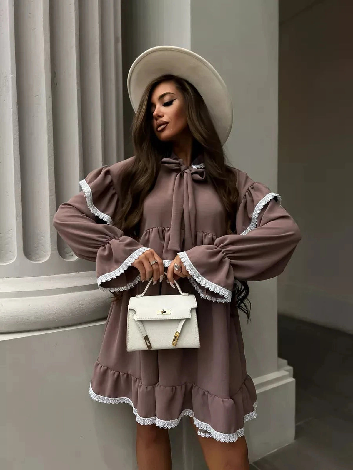 Aurora Mini Dress by Lauven featuring soft ruffles, lace trim, and a stylish hat, perfect for elegant occasions.