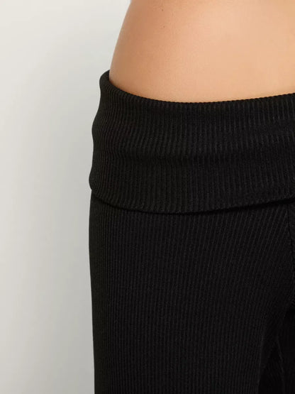 Onyx Two-Piece Set by Lauven - Close-up of the off-shoulder ribbed fabric detail on women's suit.