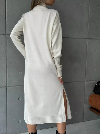 Celeste Midi Dress from Lauven showcases a women's knit dress in soft beige, featuring a high neckline and side slit.