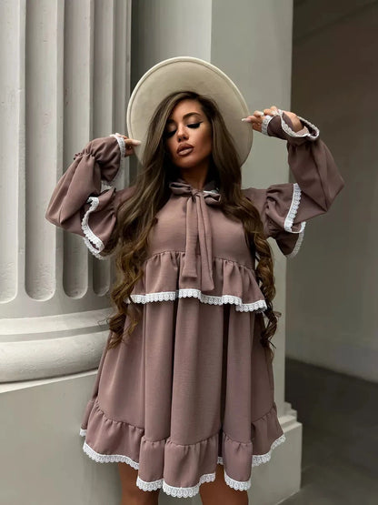 Aurora Mini Dress by Lauven featuring soft ruffles, delicate lace trim, and a stylish oversized cut.