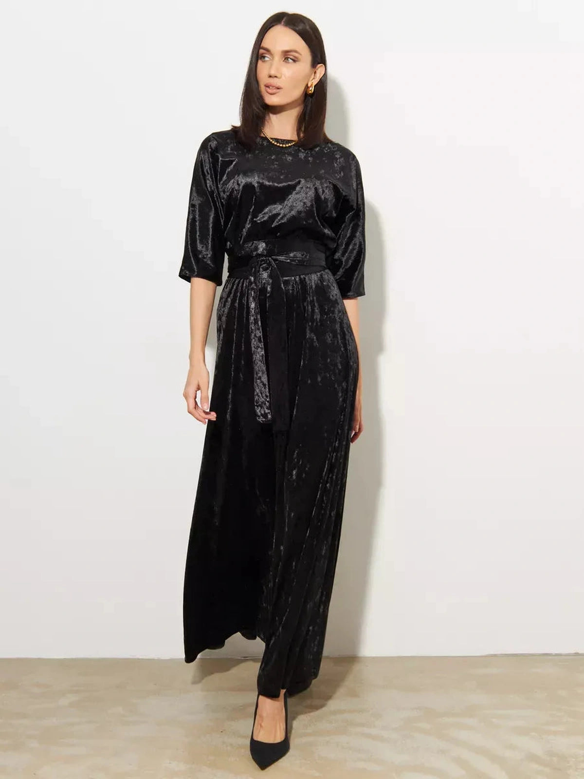 Elegant model showcasing the Noiré Maxi Dress by Lauven, a black velvet A-Line evening gown.