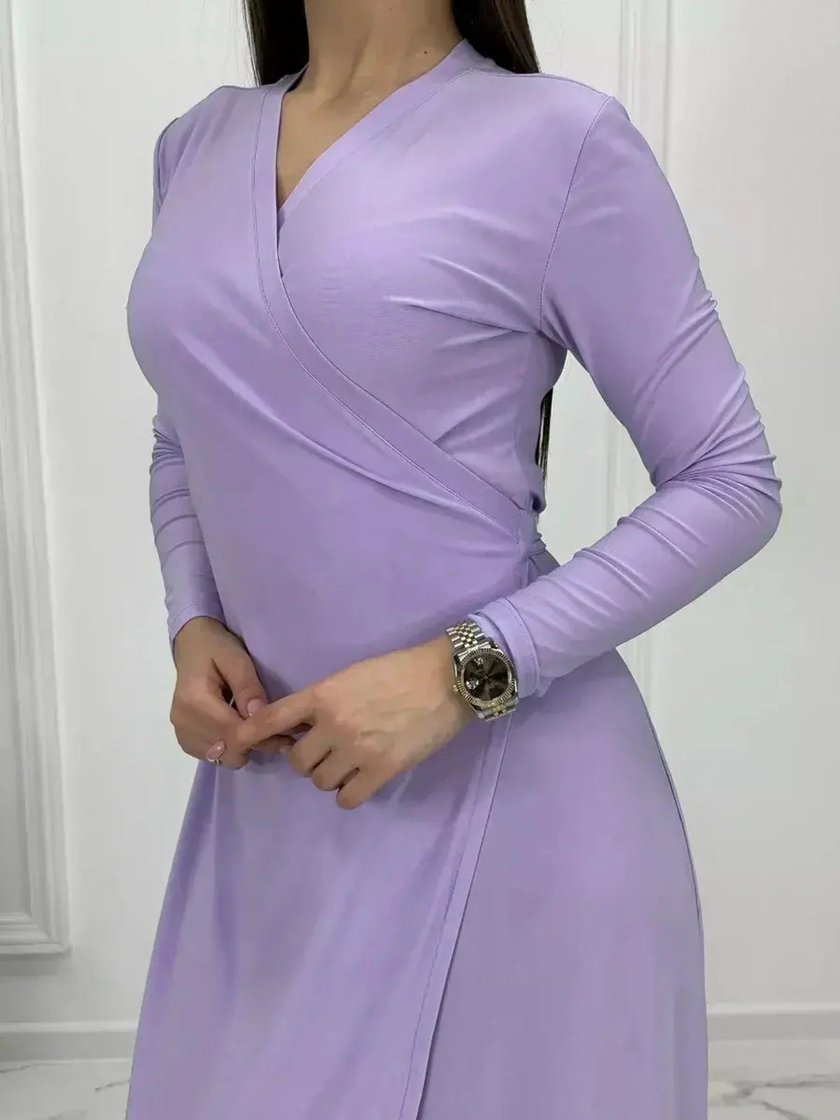 Close-up of Lilac Mirage Maxi Dress featuring elegant wrap design and long sleeves.