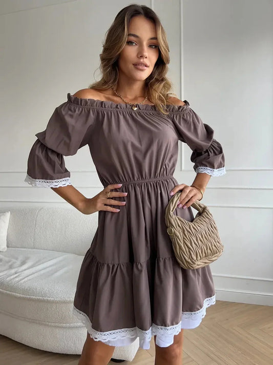 Model showcasing the Mocha Muse off-shoulder mini dress with ruffle trim, styled effortlessly for summer elegance.