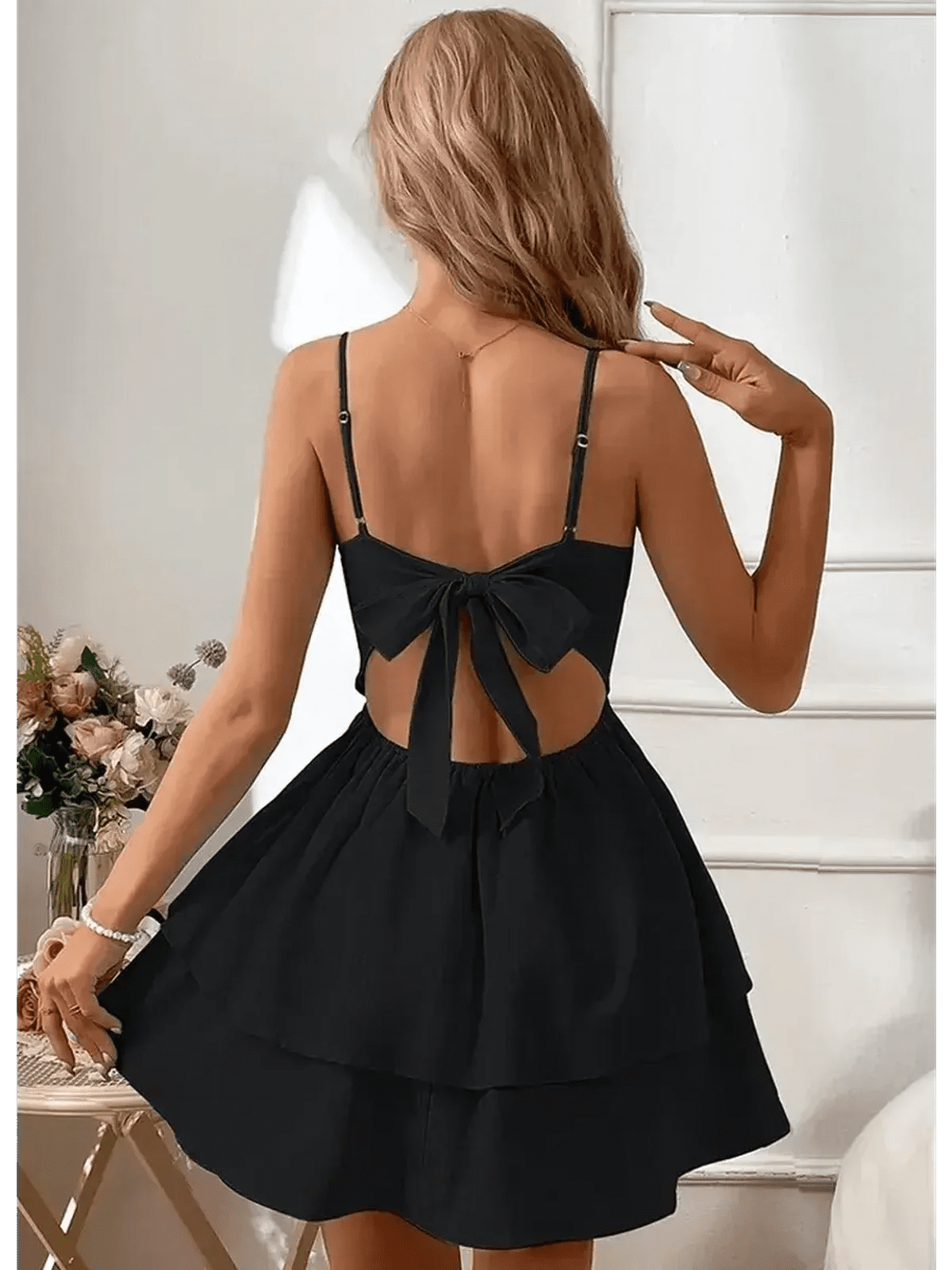 Noir Bloom Mini Dress featuring a tiered flounce skirt and corset-inspired back with bow detail.