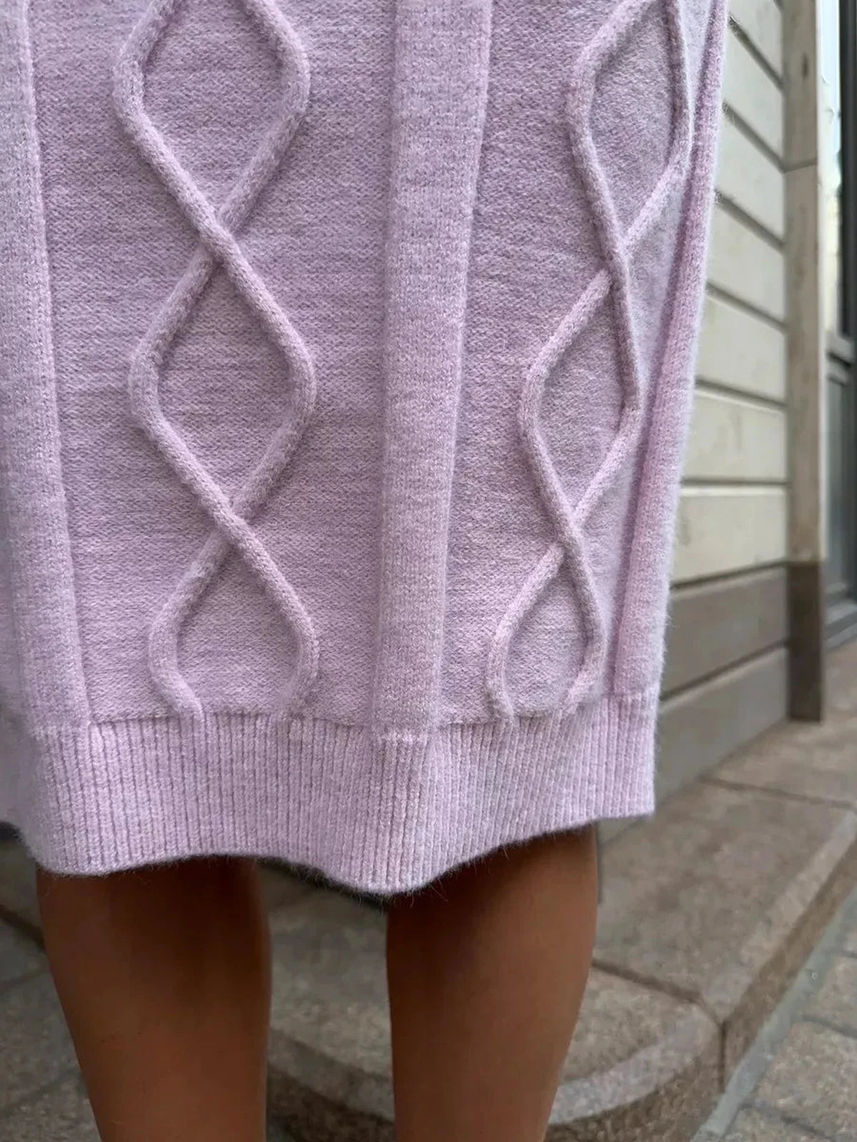 Close-up of textured knit detailing on the Luna Midi Dress by Lauven in soft pink.