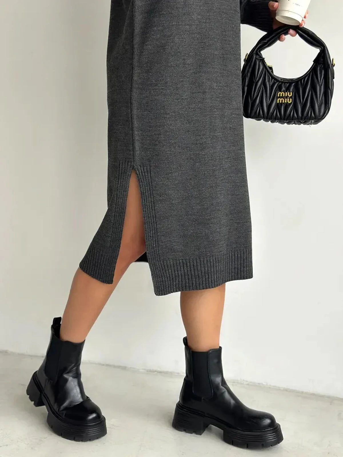 Asteria Midi Dress by Lauven featuring a side slit, paired with black ankle boots and a stylish handbag.