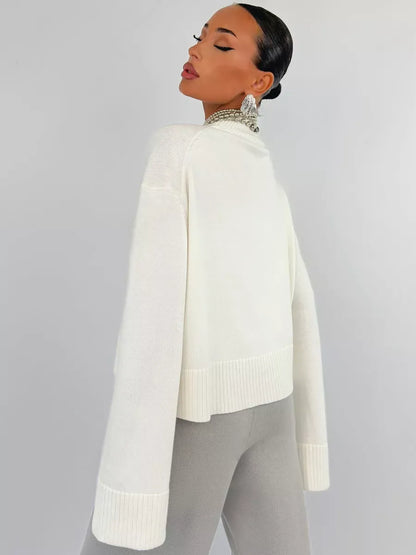 Model showcasing the Bianca Sweater by Lauven, an oversized cotton blend knit in white.