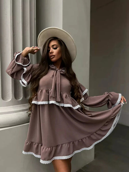 Aurora Mini Dress from Lauven, featuring soft ruffles and delicate lace trim, perfect for effortless elegance.