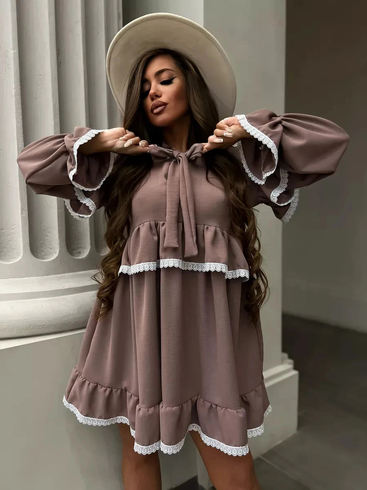 Aurora Mini Dress by Lauven featuring soft ruffles and delicate lace trim on a stylish model.