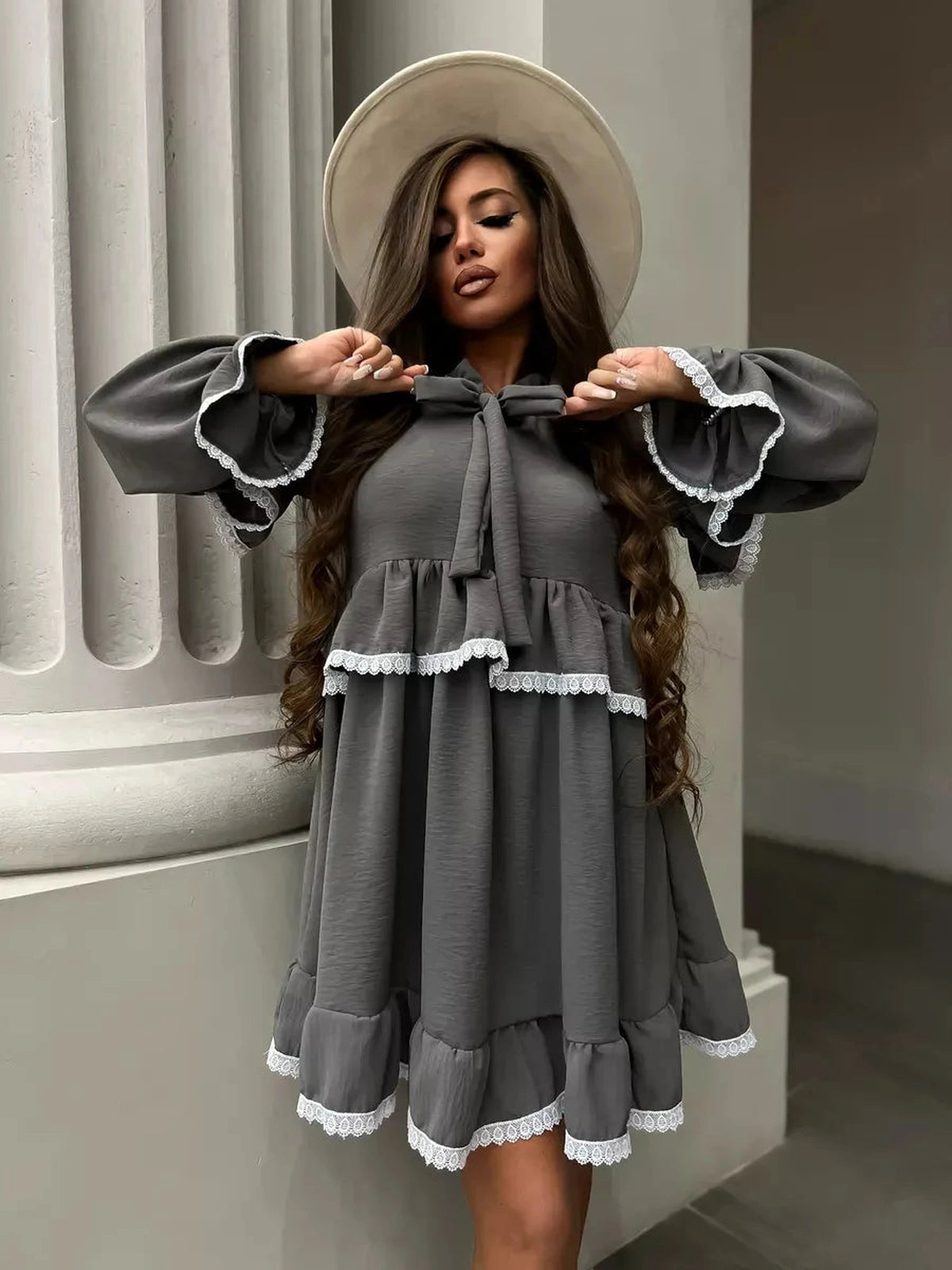 Luna Mini Dress by Lauven showcasing elegant ruffled design and lace trim, perfect for stylish women.