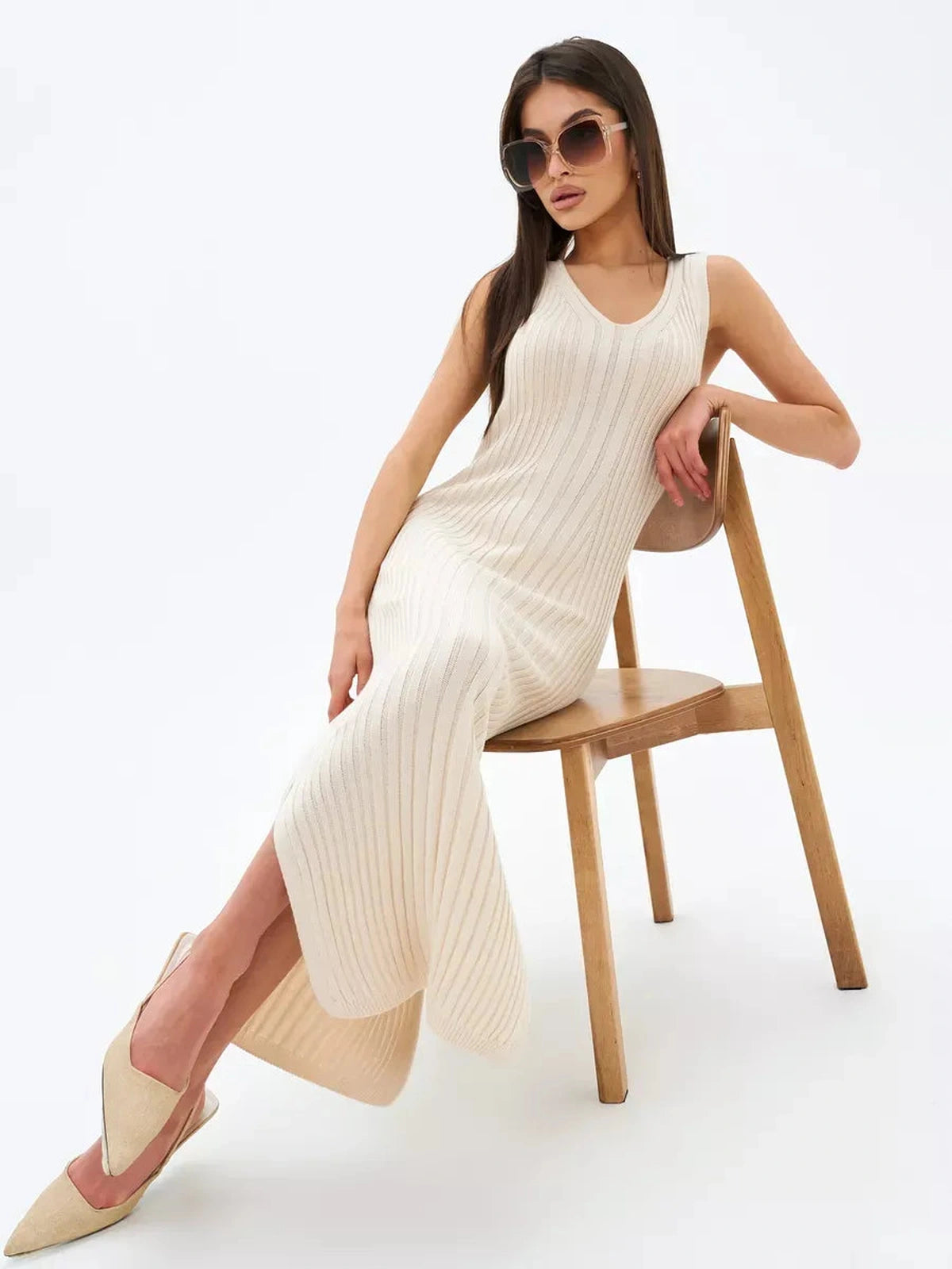 Evelyn Midi Dress by Lauven in ribbed knit, featuring side slits and sleeveless design, exuding elegance.