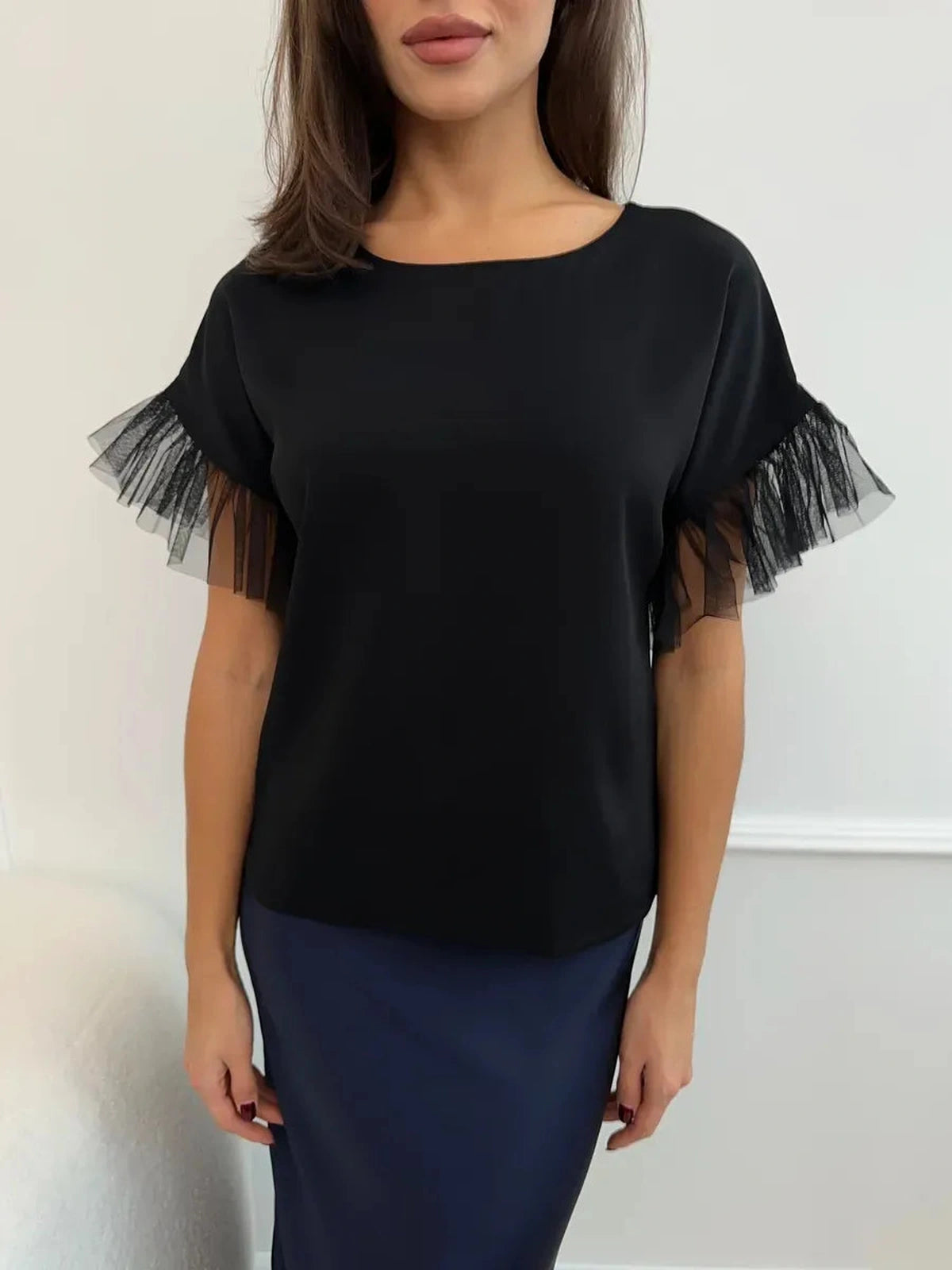 Noiré Blouse by Lauven - Elegant short sleeve black blouse with tulle ruffle detail.