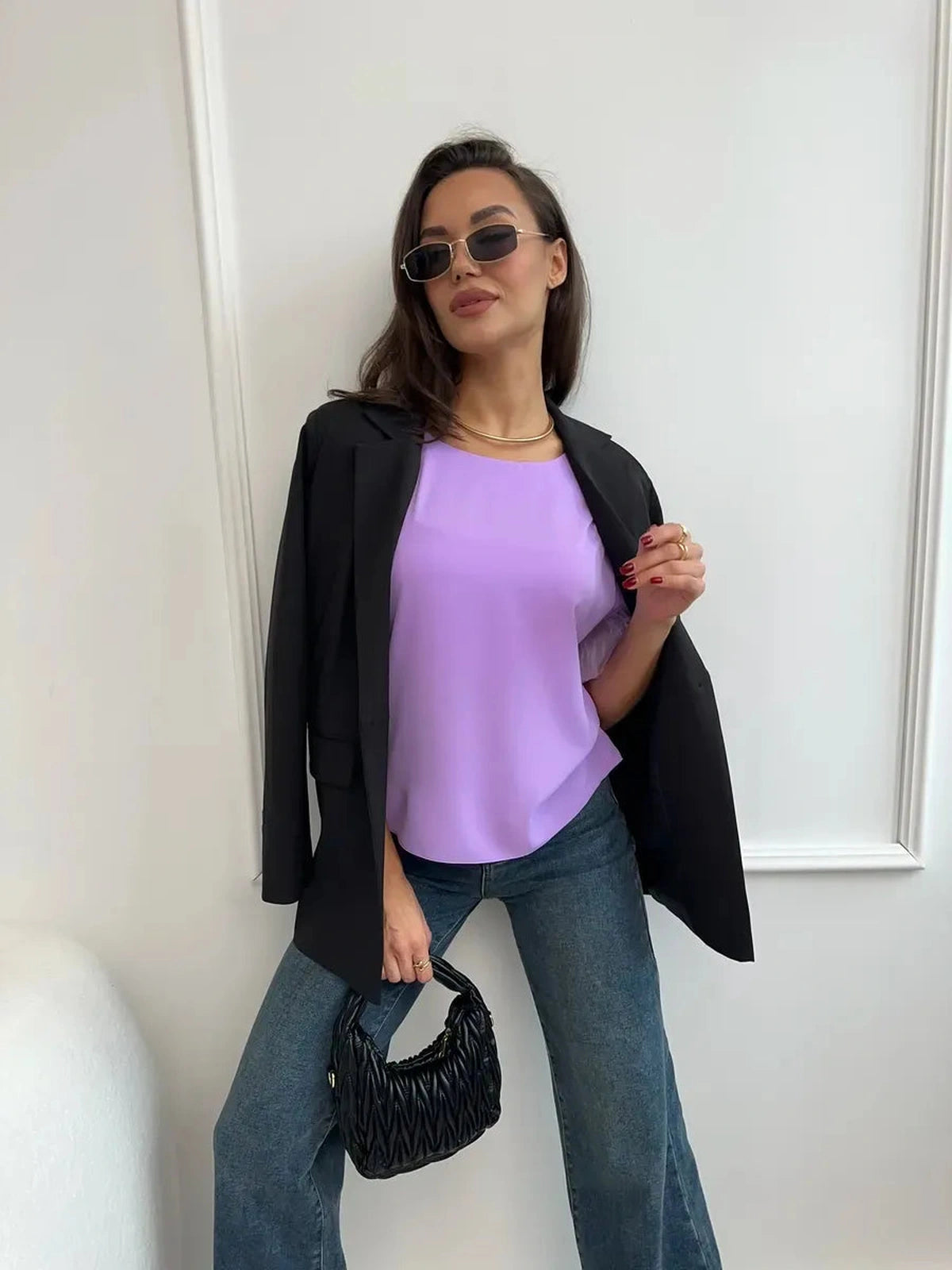 Lavande Blouse worn with a black blazer, showcasing its lilac color and chic style, perfect for modern fashion.