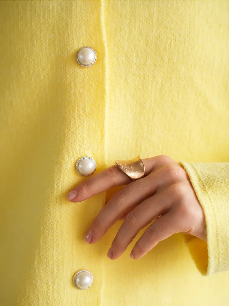Lemonade Cardigan by Lauven featuring a bright yellow knit and pearl button details, perfect for stylish layering.