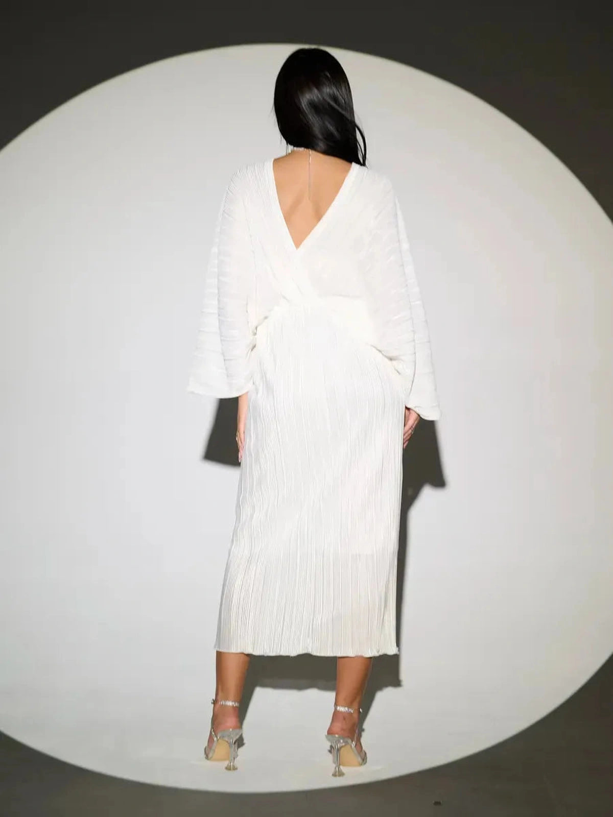 Selene Midi Dress by Lauven - Elegant pleated white dress showcasing a flattering silhouette from the back.