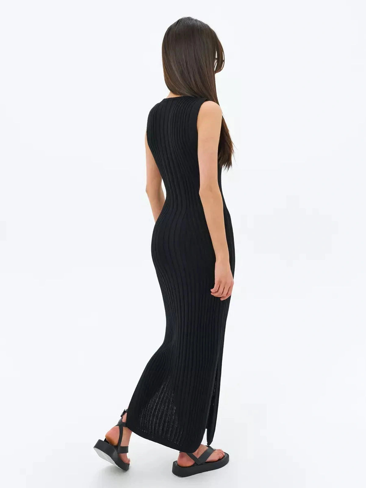 Noir Midi Dress by Lauven, showcasing a sleek black ribbed knit design in a sophisticated silhouette.