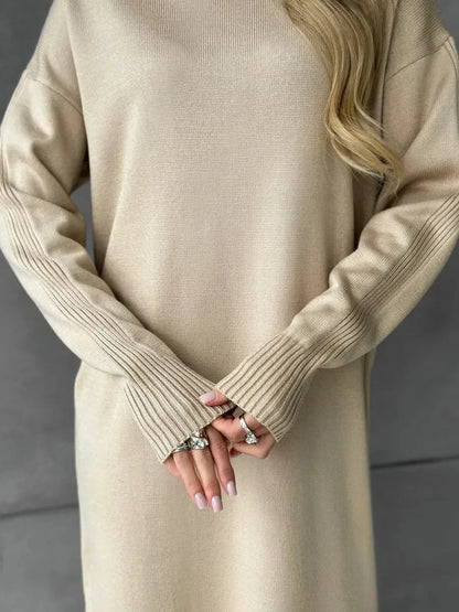 Seren Midi Dress by Lauven showcasing a cozy beige knit fabric with a high-neck collar and detailed ribbed sleeves.