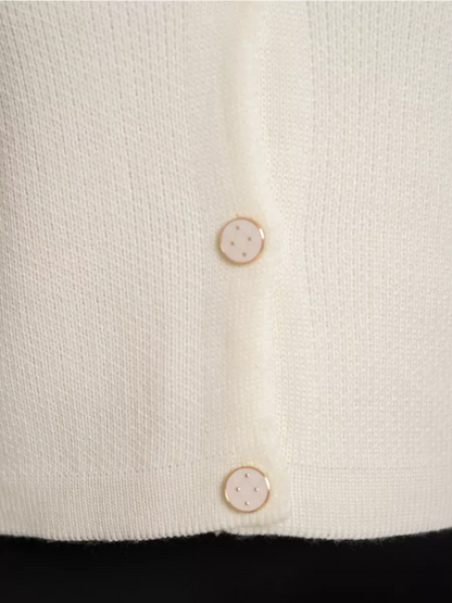 Ivory Cardigan by Lauven featuring decorative buttons in a creamy white knit fabric.