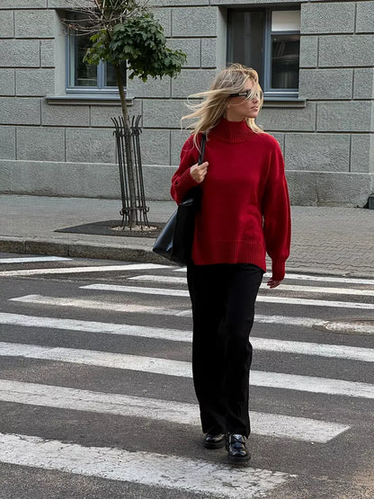 Sienna Sweater by Lauven, oversized women's knit turtleneck in deep red worn casually on the street.