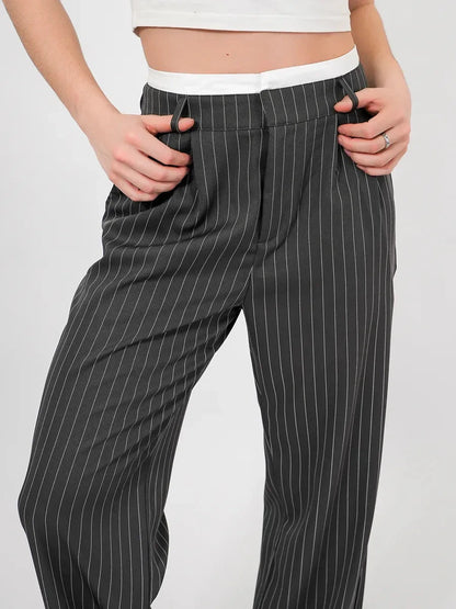 Luna Pants by Lauven, elegant high-waist wide-leg trousers featuring a subtle pinstripe pattern.