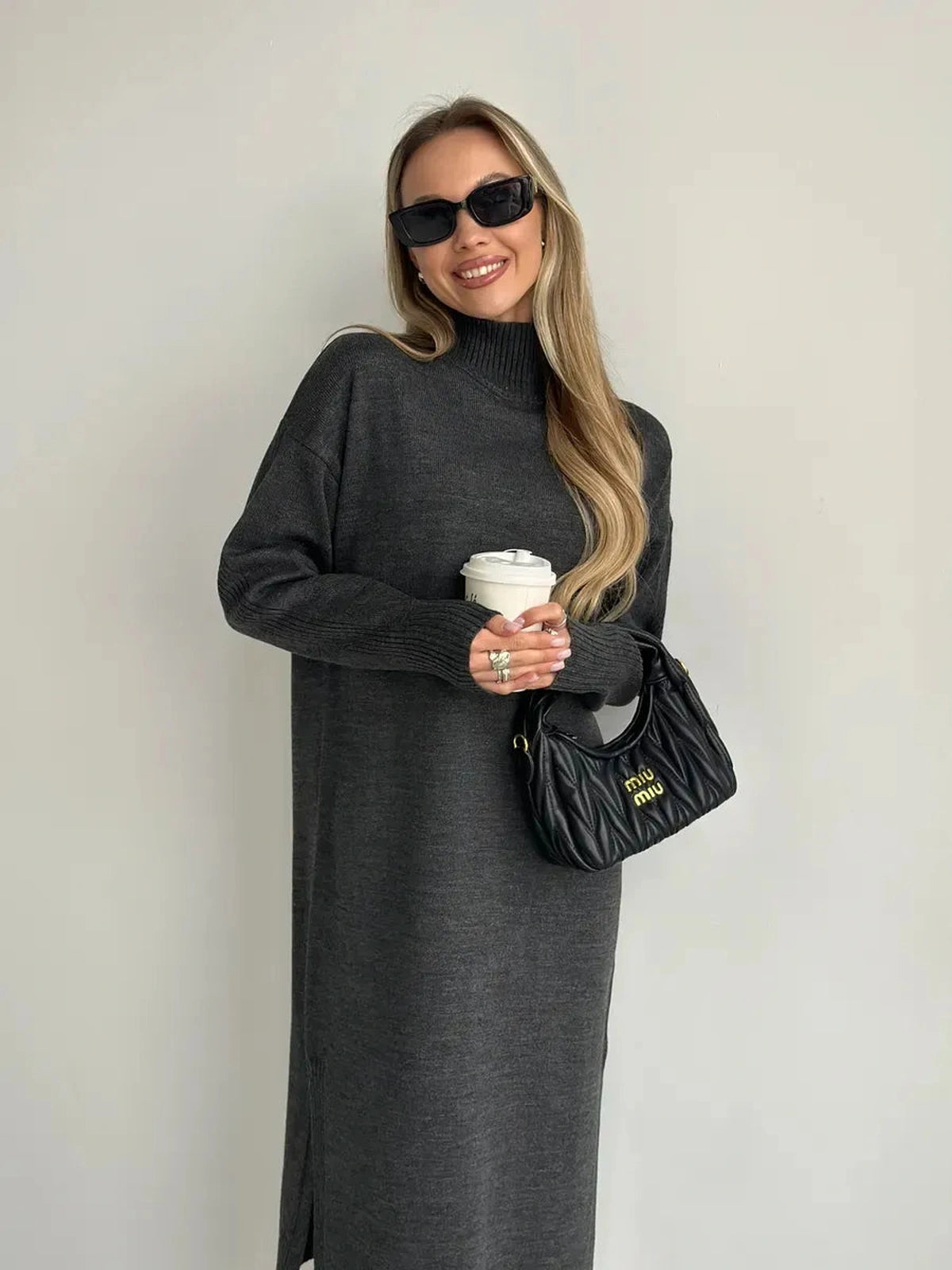 Asteria Midi Dress by Lauven, featuring a cozy knit texture, high collar, and relaxed silhouette.