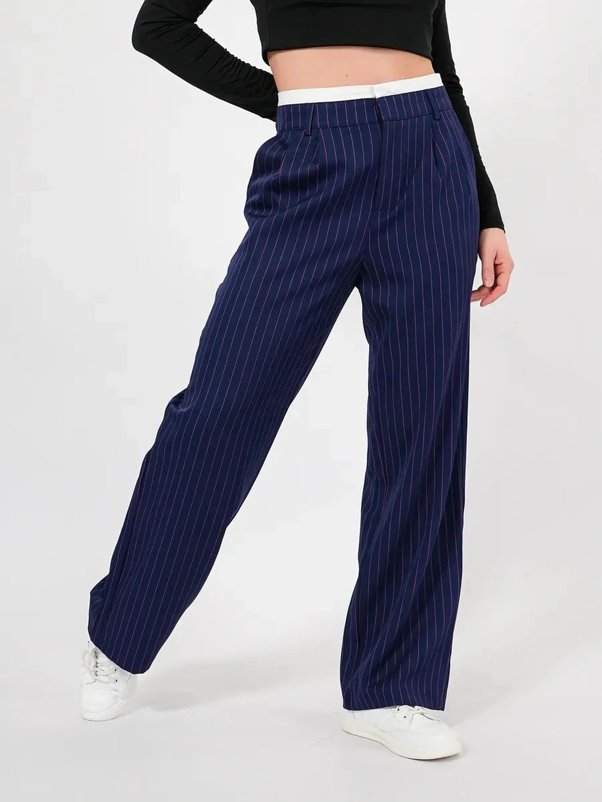 Aster Pants by Lauven in navy pinstripes, showcasing a refined high-waist wide-leg silhouette.