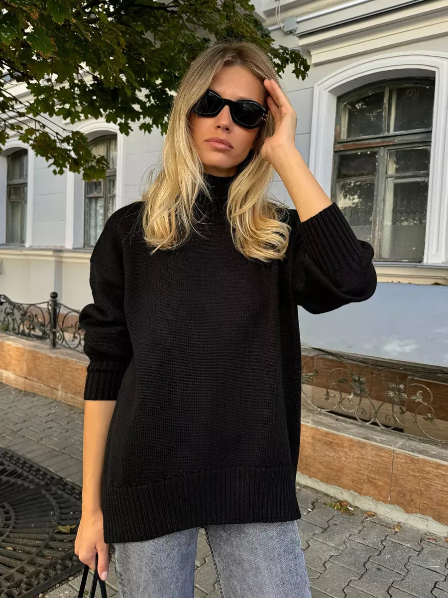 Nyra Sweater by Lauven - Oversized women's black wool knit with high turtleneck, perfect for cooler seasons.