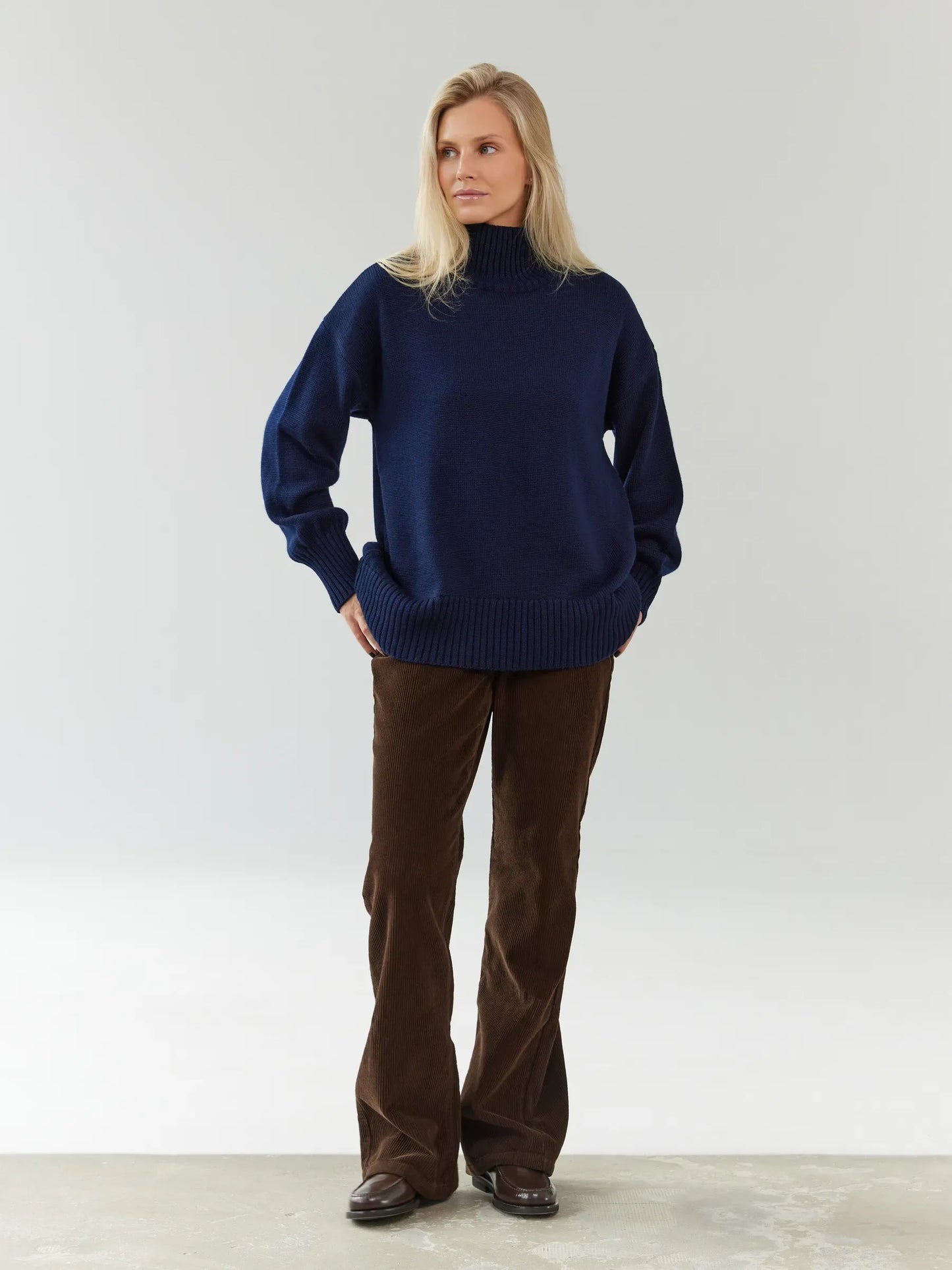 Celeste Sweater by Lauven, oversized women's wool knit in dark navy, featuring a stylish turtleneck and relaxed fit.