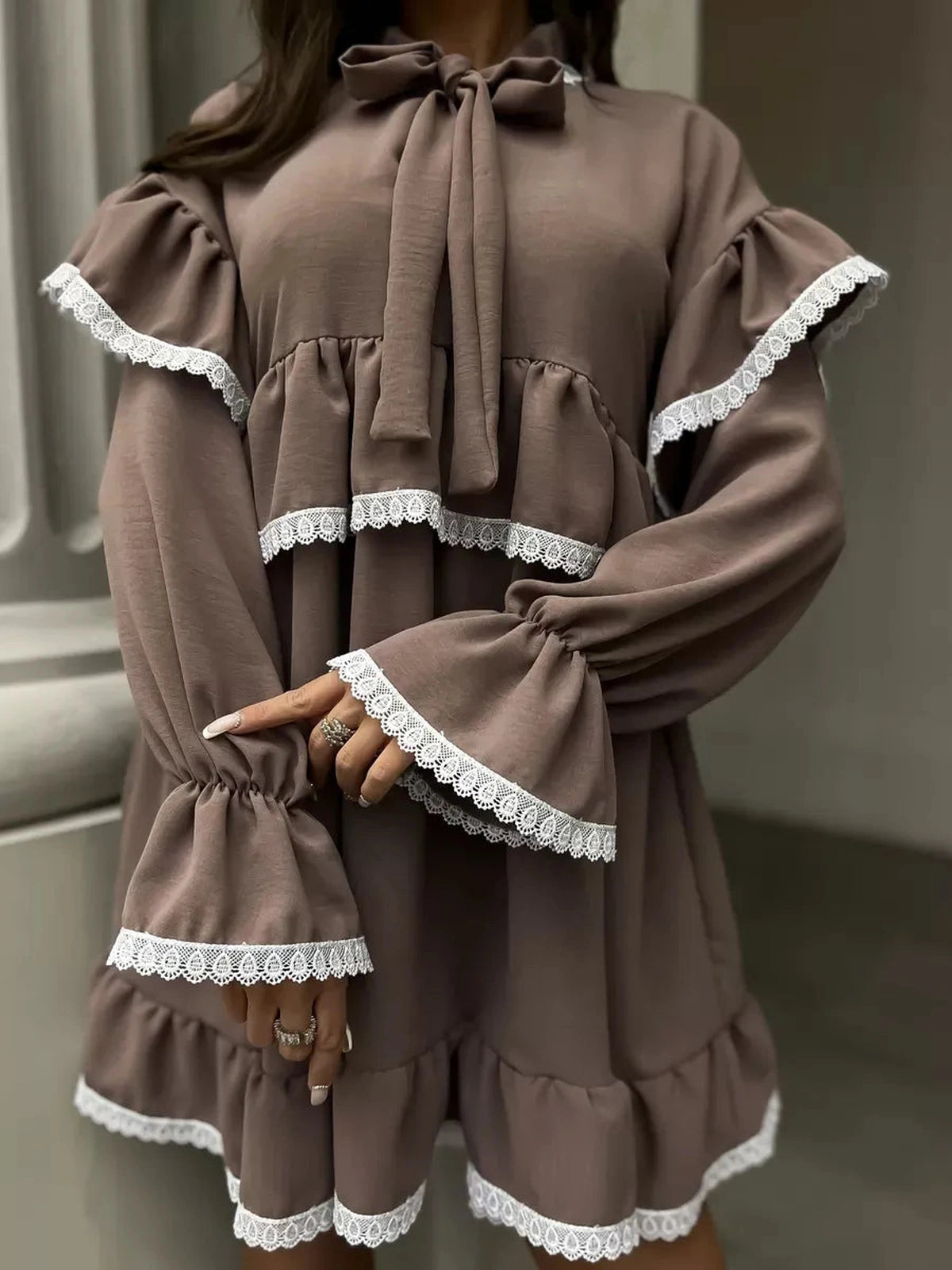 Aurora Mini Dress by Lauven featuring soft ruffles and delicate lace trim in a stylish brown.