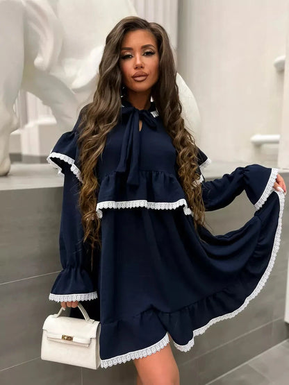 Celeste Mini Dress by Lauven, featuring graceful ruffles and lace accents in dark navy.