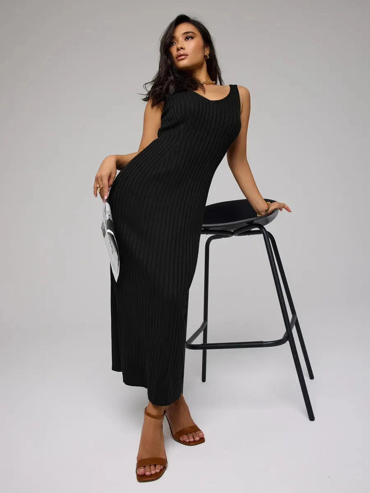Noir Maxi Dress by Lauven - Sleek black ribbed knit dress showcasing a body-hugging silhouette on a model.