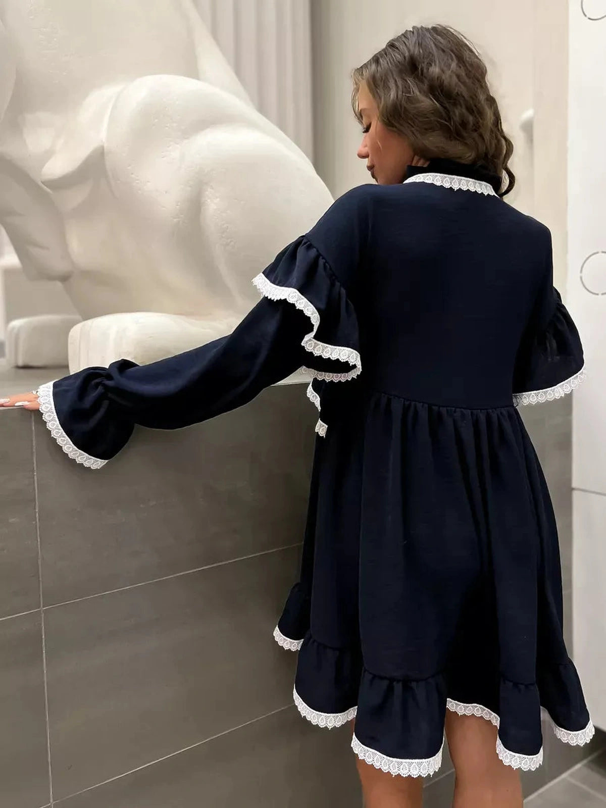 Celeste Mini Dress by Lauven featuring graceful ruffles and lace accents in dark navy.