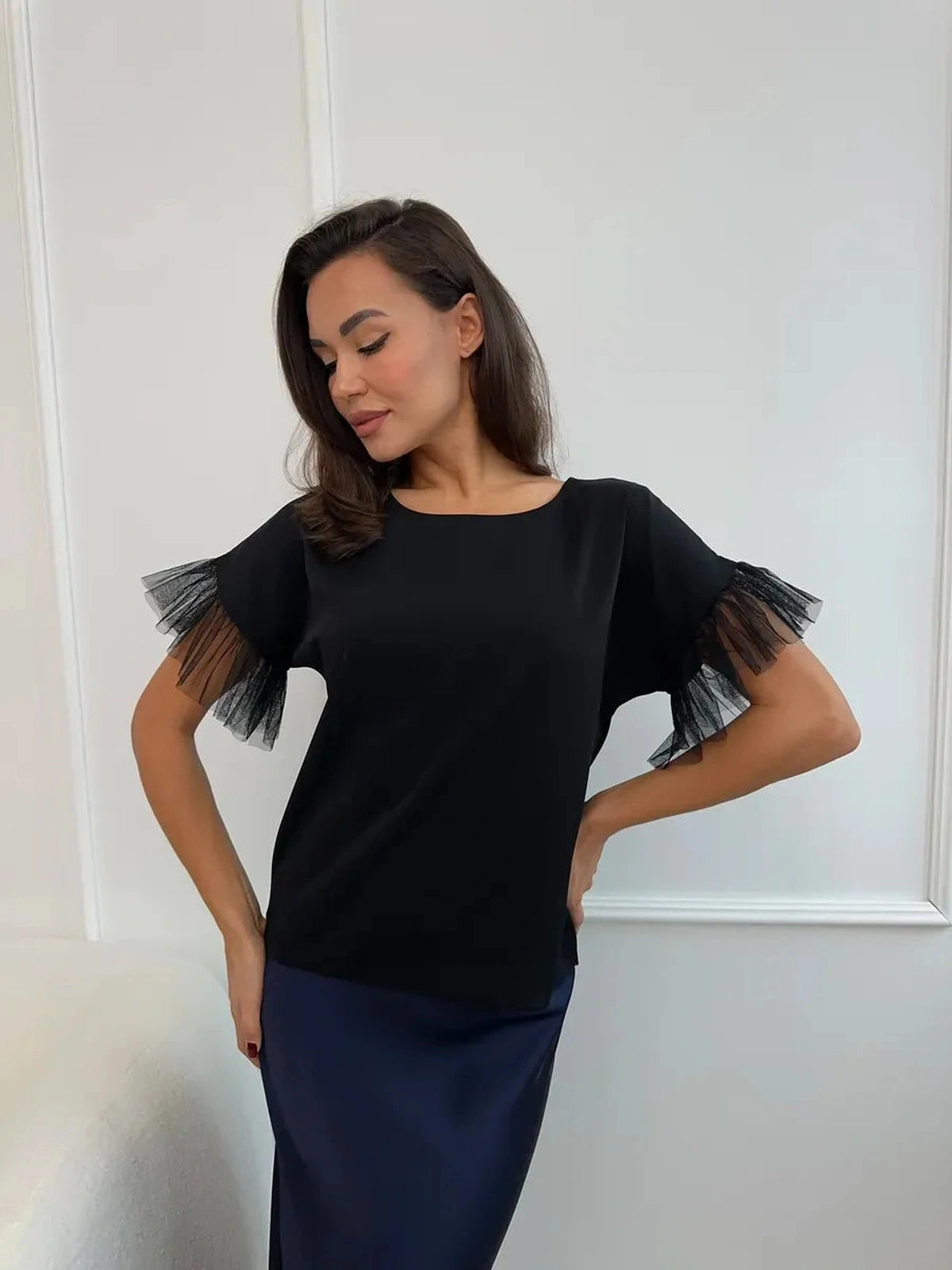 Noiré Blouse by Lauven - Elegant black blouse with tulle ruffle details, perfect for any occasion.