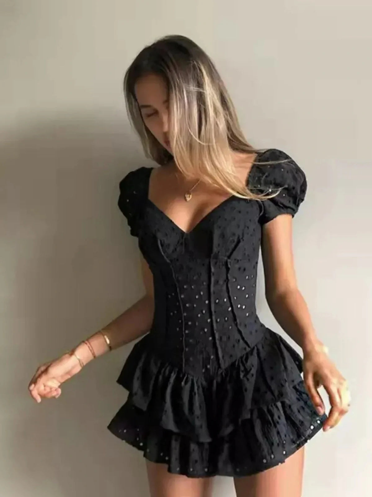 Blackberry Corset mini dress featuring puff sleeves, ruffles, and a sculpted silhouette for bold femininity.